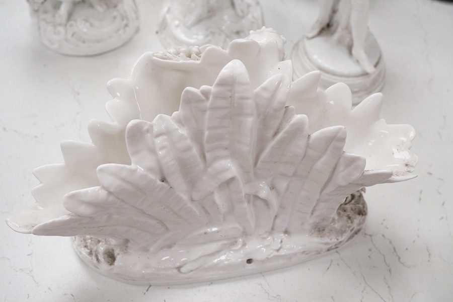 Three Continental white glazed figures and an English bone china group, tallest 25cm